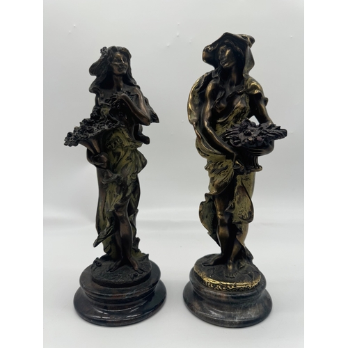 234 - Two bronze effect resin figures - 31cm