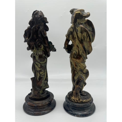 234 - Two bronze effect resin figures - 31cm