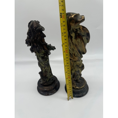 234 - Two bronze effect resin figures - 31cm