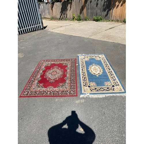 786 - A handmade blue Kayam Rug and a red rug