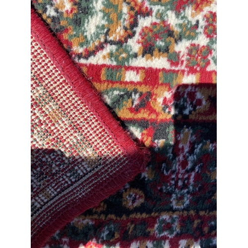 786 - A handmade blue Kayam Rug and a red rug