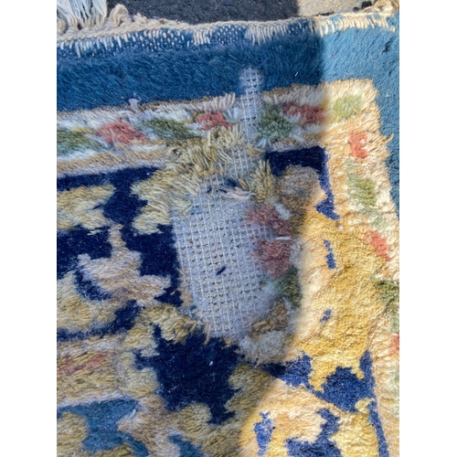 786 - A handmade blue Kayam Rug and a red rug