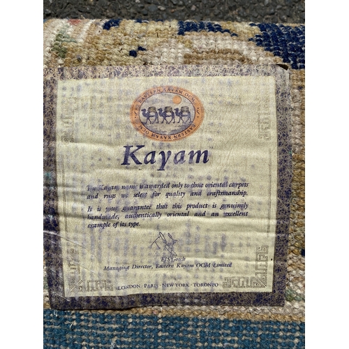 786 - A handmade blue Kayam Rug and a red rug