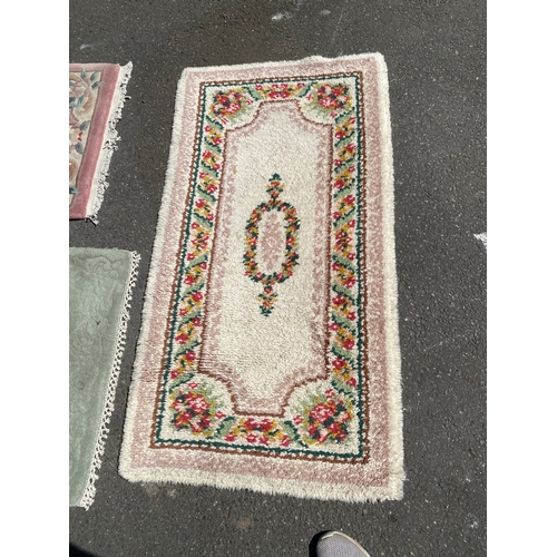 787 - Three small miscellaneous rugs