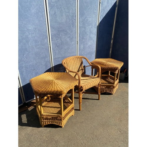 817 - Two wicker tables and a wicker arm chair