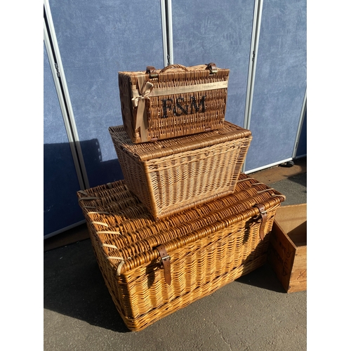 819 - A collection of wicker baskets and a wooden crate including Fortum & Mason Basket