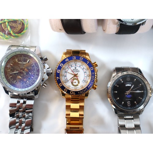 24 - Collection of watches including copies of Rolex, Breitling, Tag Heuer + Gold plated Gucci Watch