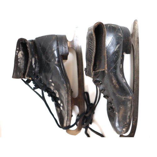 28 - Two pairs of vintage womans ice skates in a canvas bag