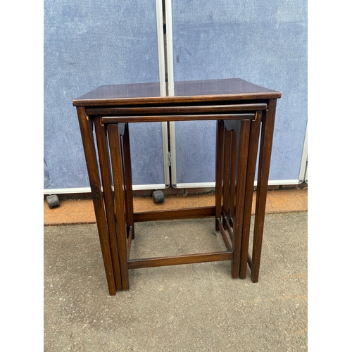 646 - Antique mahogany nest of three tables.