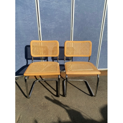 650 - A pair of Italian rattan seat/back chairs