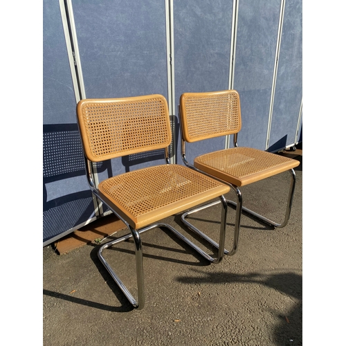 650 - A pair of Italian rattan seat/back chairs