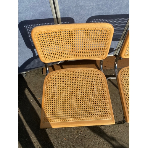 650 - A pair of Italian rattan seat/back chairs