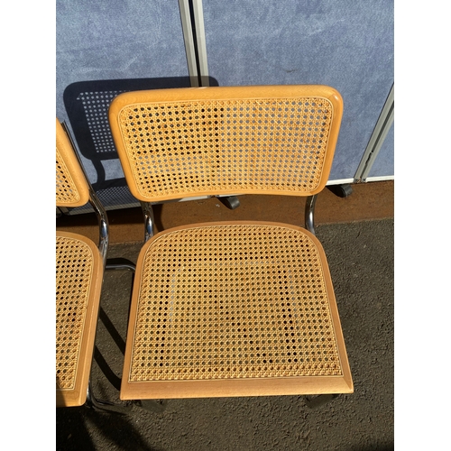 650 - A pair of Italian rattan seat/back chairs