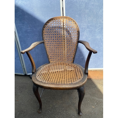 658 - A vintage leather swivel office chair and rattan seat/back arm chair.