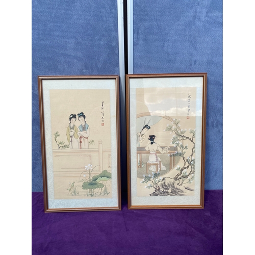 672 - A pair of oriental inspired art works