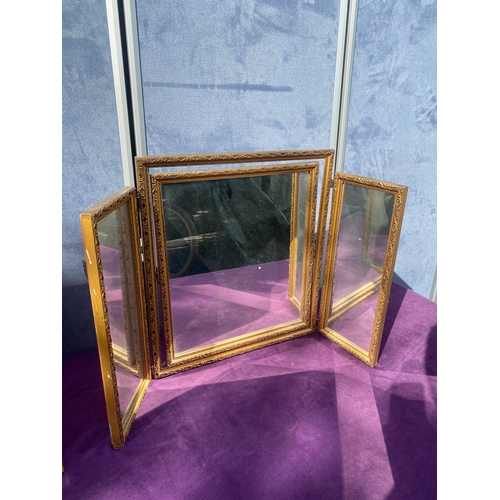 687 - Two gilt framed free standing dressing table mirrors.