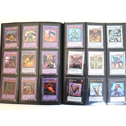 Yu-Gi-Oh Trading Cards A folder of 349 cards from 2002 -2012  including Ultra Rare, Secret Rare, Ultimate Rare, Lots of 1st Editions