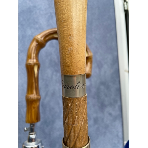 210 - Decorative Ceramic Umbrella/stick stand with wooden walking sticks and Umbrellas.