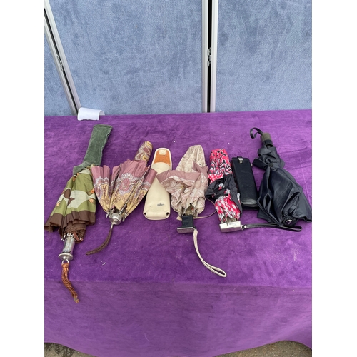 211 - A collection of Vintage/Retro travel umbrellas including Knirps.