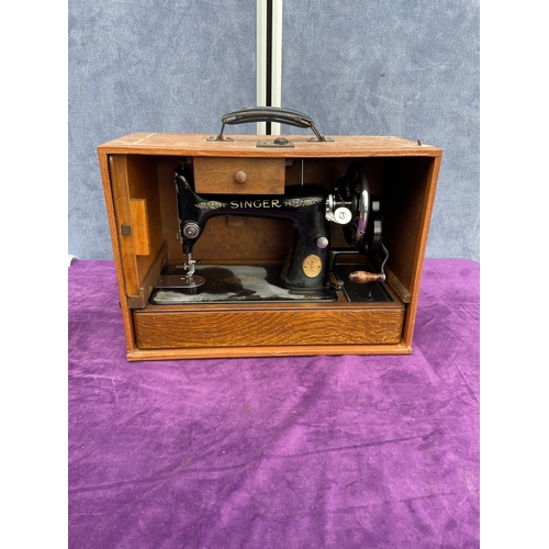 212 - Vintage Singer sewing machine in carry case.
