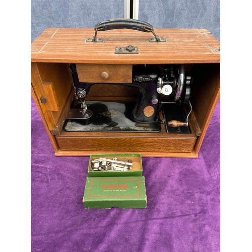 212 - Vintage Singer sewing machine in carry case.