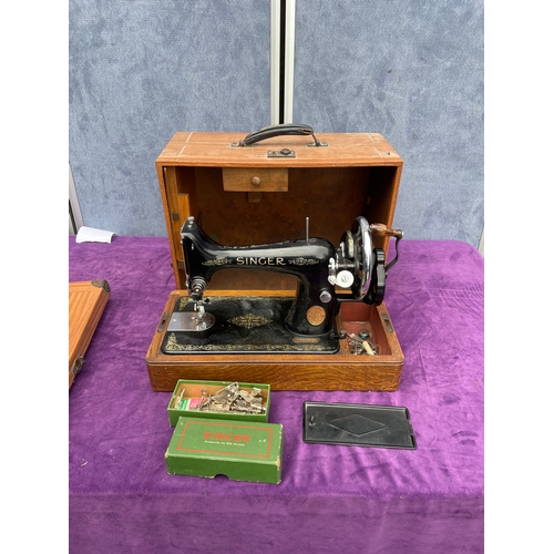 212 - Vintage Singer sewing machine in carry case.