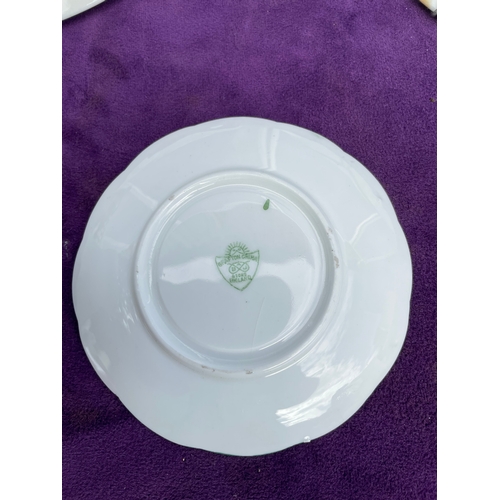 217 - A collection of miscellaneous ceramics including plates and mugs.