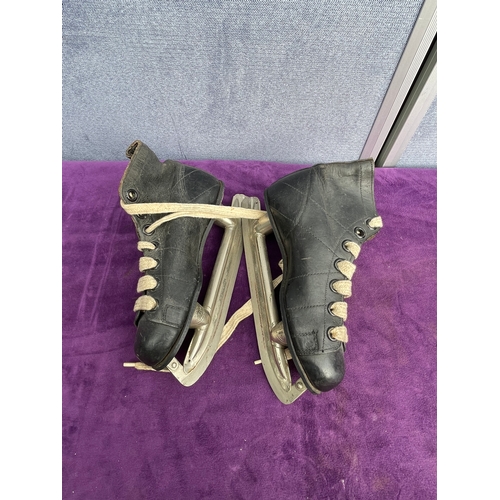 218 - Signed Mitre Rugby ball and vintage skates.