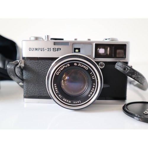 49 - Olympus 35mm Cameras - 35 SP w/ 1:1,7 42mm lens & OM-2 n w/ 1:1,8 50mm lens