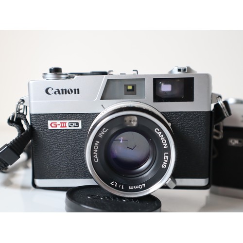 55 - Canon 35mm Cameras - FT QL w/ 1:1,8 50mm Lens, G-III QL w/ 1:1.7 40mm Lens, G-111 QL w/ 1:1.9 45mm l... 