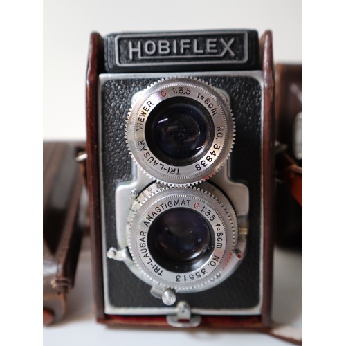 79 - Four Vintage TLR Cameras - Delmonta, Beautyflex, MPP Microcord, Hobiflex some with booklets and leat... 