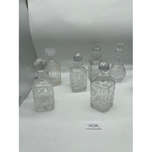 235 - Seven crystal decanters