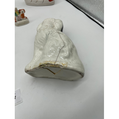 237 - A large collection of ceramic Dog Ornaments