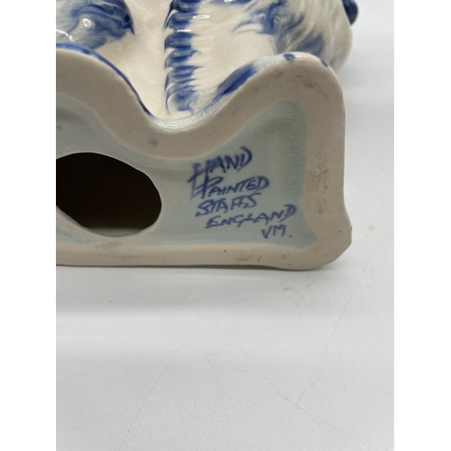 240 - A pair of Hand painted Staffs England Dogs