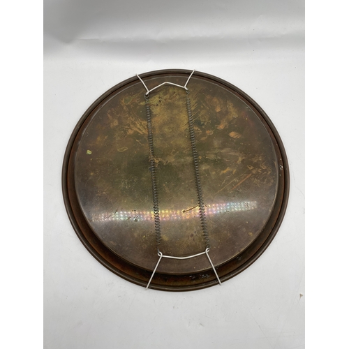 256 - Ornate small brass decorative plate.