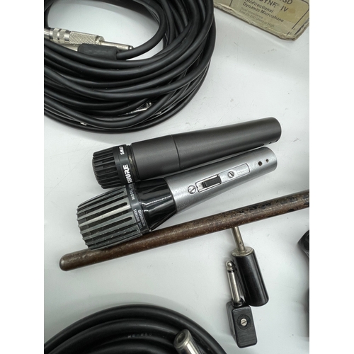 257 - A large collection of audio equipment and Leads including Microphones and stand.
