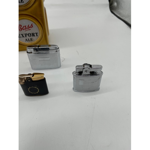 270 - Interesting collection of lighters including branded Bass Export Ale