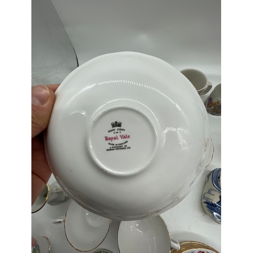 285 - A quantity of miscellaneous ceramic plates, Mugs and Teapot.