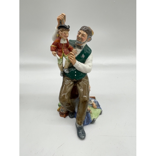 290 - Three ceramic ornaments including Royal Doulton 'The old Balloon seller', 'The Puppet maker'