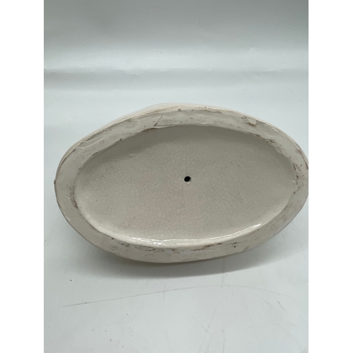 290 - Three ceramic ornaments including Royal Doulton 'The old Balloon seller', 'The Puppet maker'