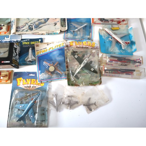 165 - A group of 1980-90's metal and plastic model aircraft from Ertl, Corgi, Majorette + others