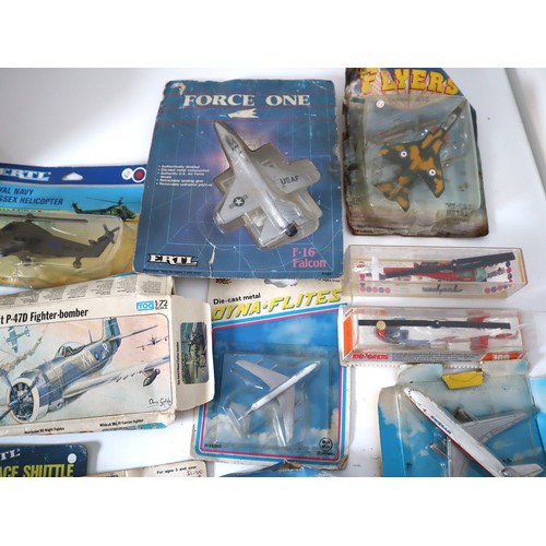 165 - A group of 1980-90's metal and plastic model aircraft from Ertl, Corgi, Majorette + others