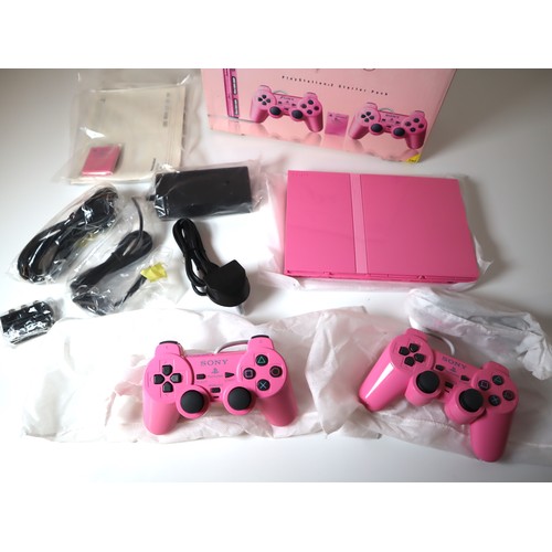 54 - Unused Playstation 2 Pink Edition in original box, with all cables, 2 x controllers, instructions an... 