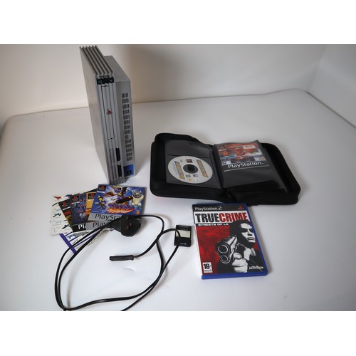 57 - Playstation 2 Silver Console, memory card, power cable + some games