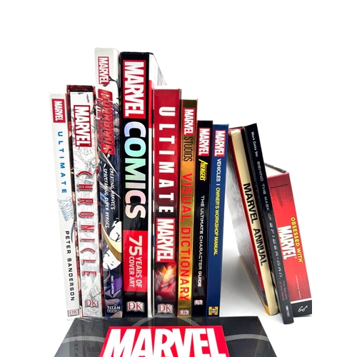146A - A group of marvel Hardback books some still sealed including The expanding universe wall chart