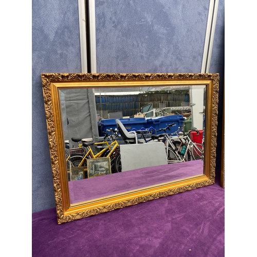 696 - Two gilt framed mirrors