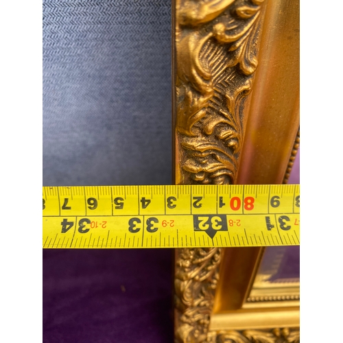 696 - Two gilt framed mirrors