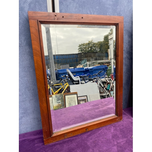 697 - Two wooden framed mirrors