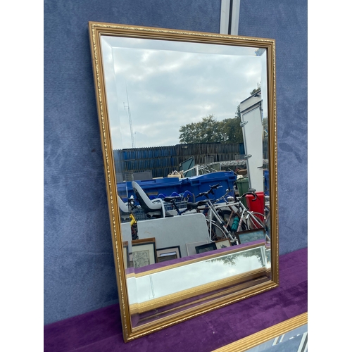 698 - Two rectangular gilt framed mirrors