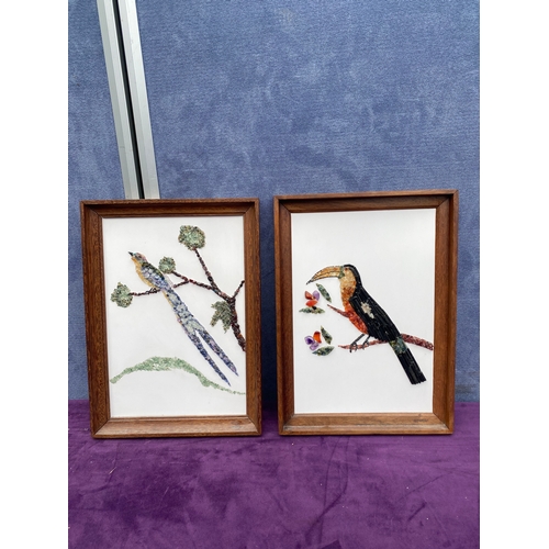 725 - Two framed gemstone art works.